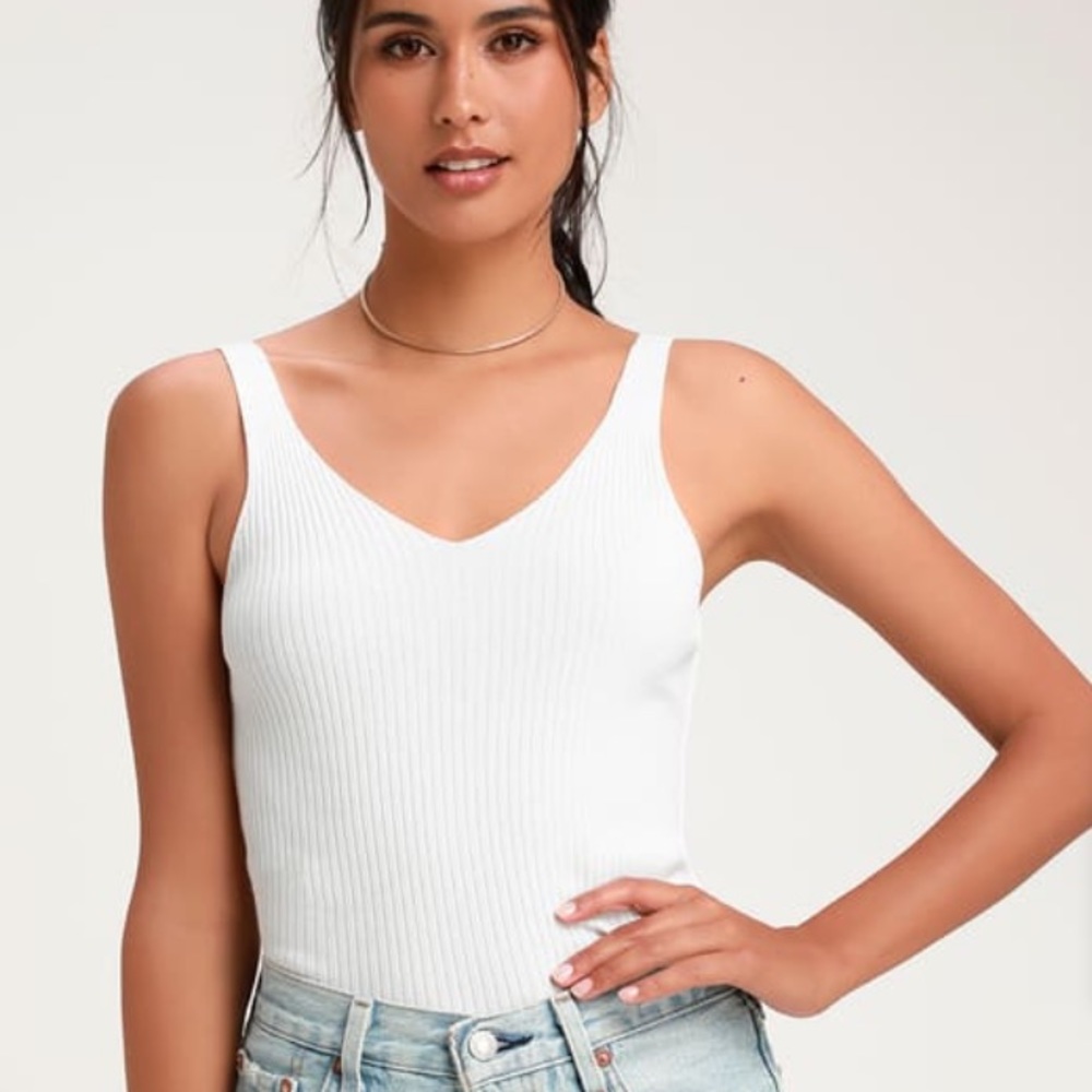 White sleeveless sweater top